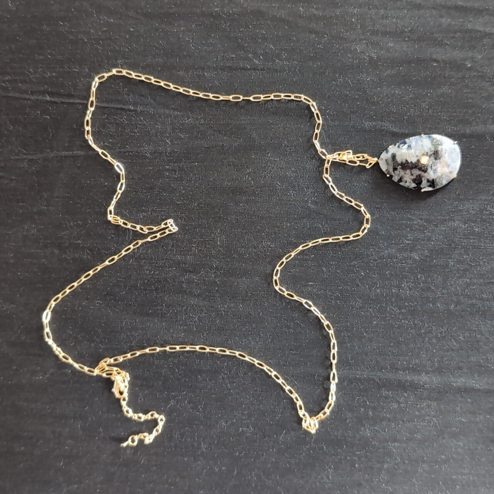 Elegant Gold Necklace with Black and Gray Pendant